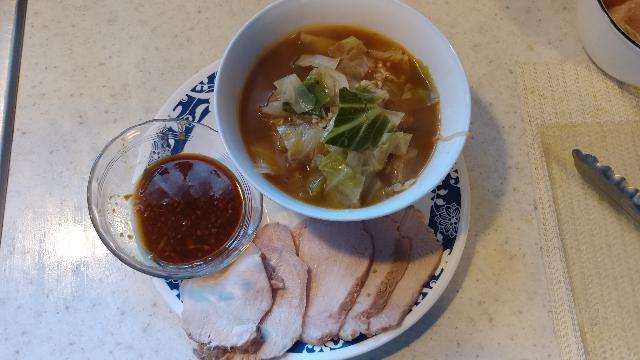 A delicious dinner of sous vide pork loin,
                                 cooked cabbage and ramen that cost about $0.40!